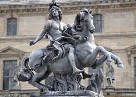sculpture oof the king louis xiv near arc de triomphe du carrousel in paris